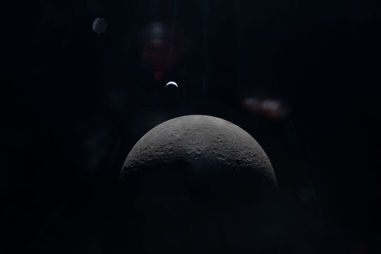 Christina Koch looks back at Earth from the Orion spacecraft during the Artemis II mission.