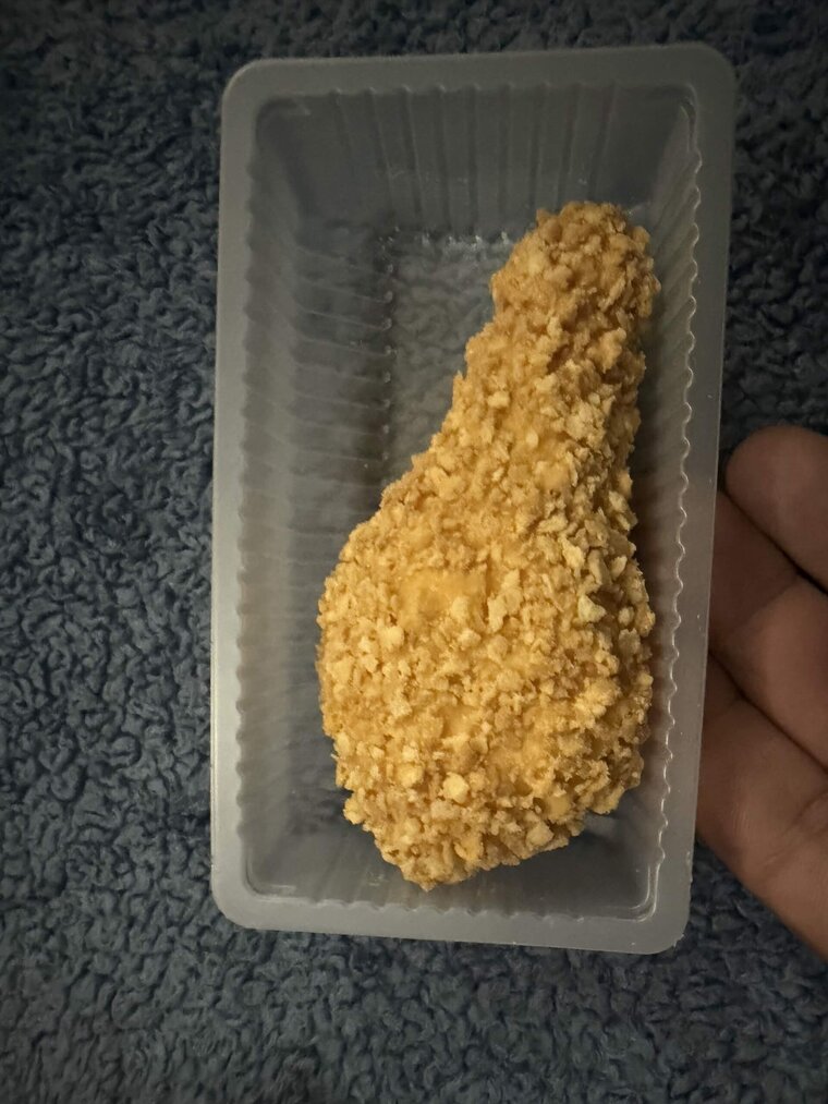 The unwrapped Fried Chicken Ice Cream bar showing its realistic crispy fried chicken appearance